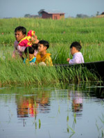 Family watching the parade, Lake Inle, Myanmar - formerly Burma