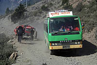 Bus and dust on road