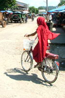 Novice monk on a bike, Hsipaw, Myanmar