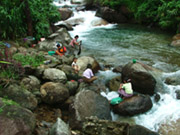 Locals in in the river, Kyaiktiyo, Myanmar